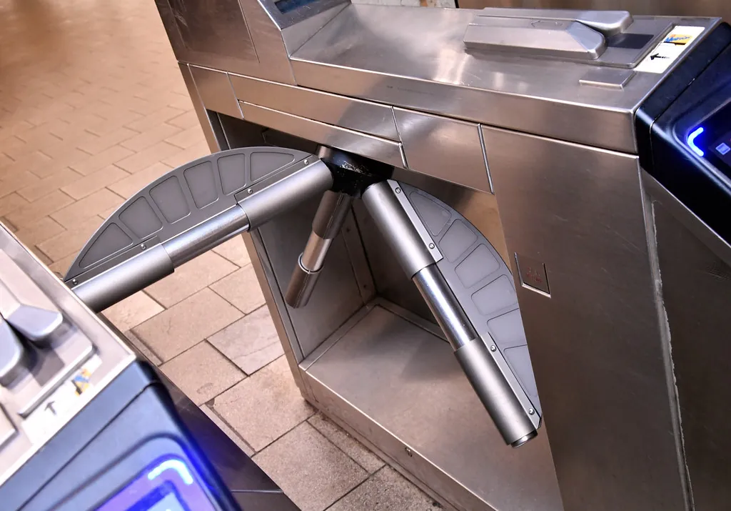 Close-up of a metal turnstile arm, marking the boundary between server and browser