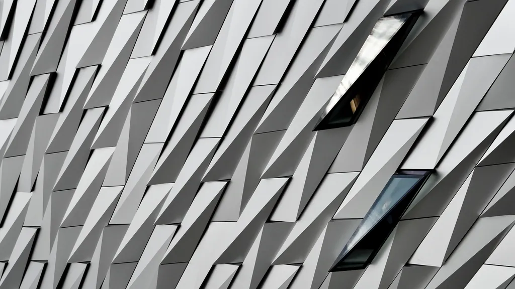 Modular glass panels on a modern building facade, like a component tree split into parts