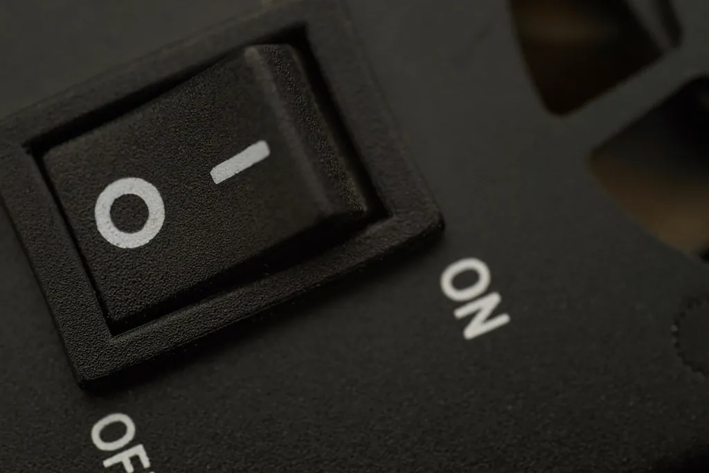 Black on and off rocker switch close-up, like one setting that enables many checks