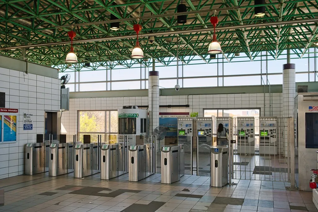 Row of ticket turnstiles in a station, like a type check gate in a CI pipeline
