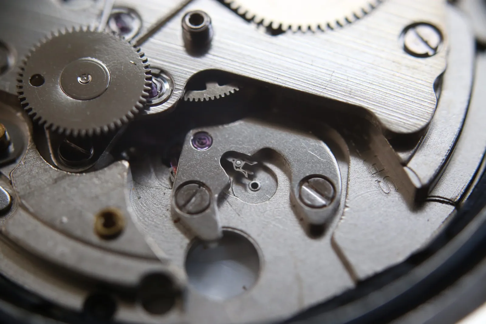 Close-up of a mechanical watch movement, a reminder that runtime support windows run out