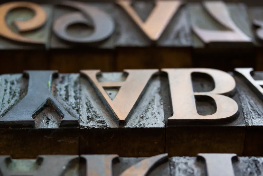 Metal letterpress letters close-up, like structured data spelling out what a page contains