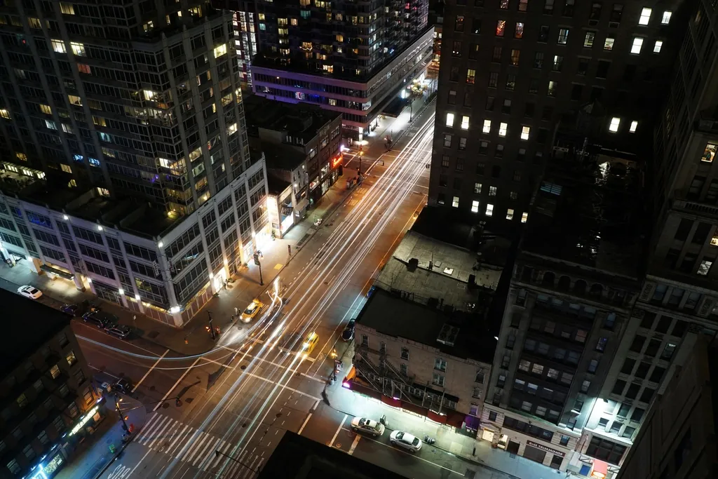 Taxi light trails on city streets from above, like realtime updates flowing to browsers
