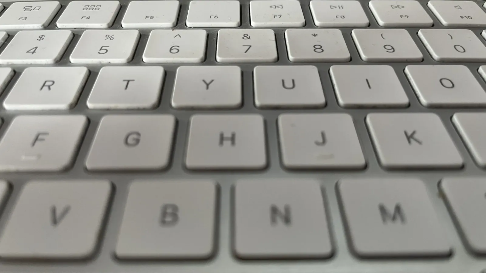 Close-up of light grey keyboard keys, since every form should work by keyboard alone