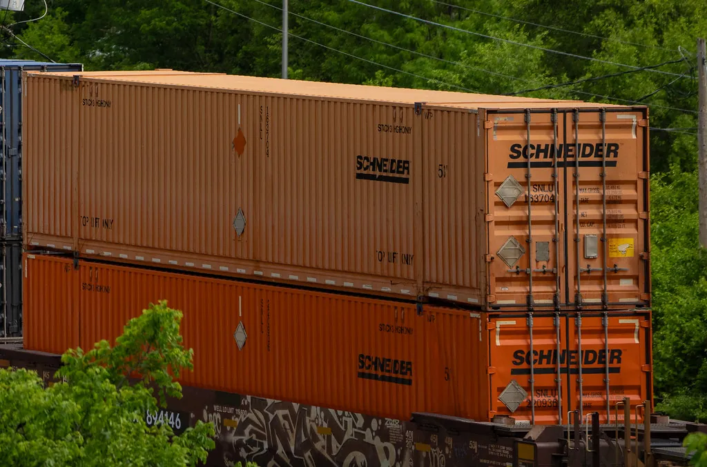 Stacked orange shipping containers, the heavyweight model that isolates are designed to avoid