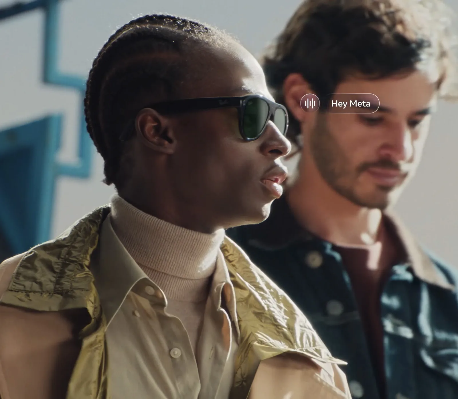 People wearing Ray-Ban Meta Gen 3 AI smart glasses with a Hey Meta voice prompt